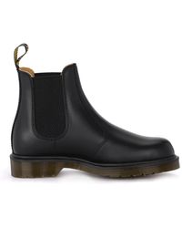 Dr. Martens - Schwarze lederstiefeletten mit elastischen einsätzen - Lyst