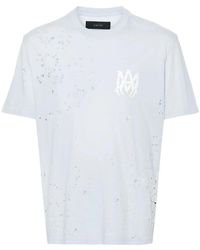 Amiri - Blaues distressed logo print t-shirt - Lyst