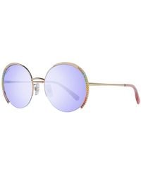 Swarovski - Occhiali da sole donna oro rotondi blu - Lyst