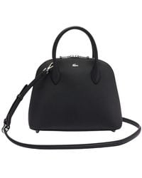 Lacoste - Daily city handtasche schwarz pvc - Lyst