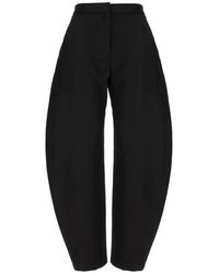 Alaïa - Alaïa High-Rise Tapered Pants - Lyst