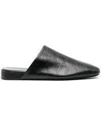 Balenciaga - Schwarze Ledermules Mit Geprägtem Logo - Lyst