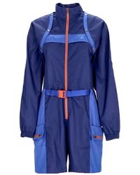 Nike - Fitness ,Blauw ,Polyester Blauwe Utility Jumpsuit Met Afneembaar Vest - Lyst