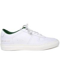 Common Projects - Sneakers basse classiche in pelle bianca - Lyst