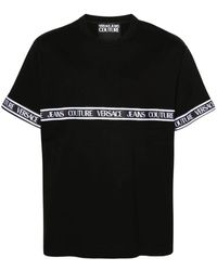 Versace - Magliette nera in cotone a coste con girocollo - Lyst