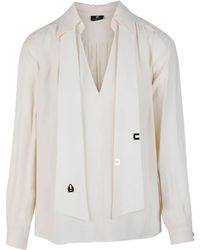 Elisabetta Franchi - Blusa elegante color crema con scollo a v e dettagli al collo - Lyst