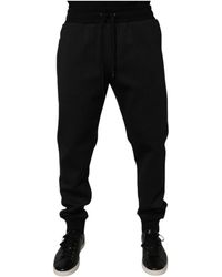 Dolce & Gabbana - Broeken ,Zwart ,Polyester Zwarte Jogger Trainingsbroeken Met Logo Details - Lyst