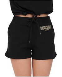 Moschino - Shorts con stampa logo e decorazione in str - Lyst