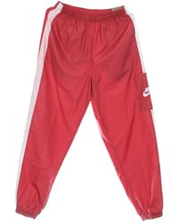 Nike - Fitness ,Roze ,Polyester Essentiële Geweven Jogger Trainingsbroek Roze/Wit - Lyst