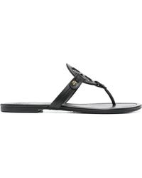 Tory Burch - "Miller" schwarze Lear-Flip-Flops - Lyst