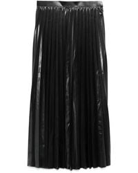 Junya Watanabe - Schwarzer plissierter rock mit glänzendem finish - Lyst