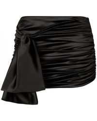 Dolce & Gabbana - Minifalda de satén negro con detalle de nudo - Lyst