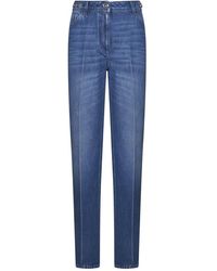 Versace - Jeans blu su misura hardware medusa - Lyst