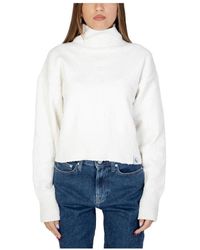 Calvin Klein - Maglione bianco a collo alto per donne - Lyst
