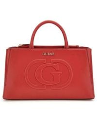 Guess - Rote handtasche mit verstellbarem schulterriemen und logo-beschriftung - Lyst