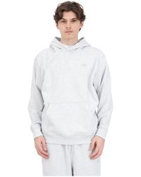 New Balance - Grauer hoodie mit logo und kängurutasche - Lyst