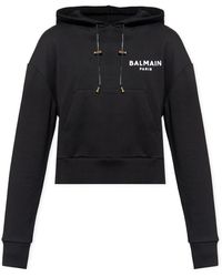 Balmain - Cropped sweatshirt mit kapuze und logo-print - Lyst