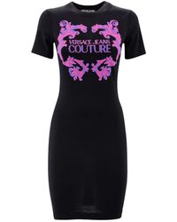 Versace - Schwarze t-shirts und polos mit logo-print - Lyst