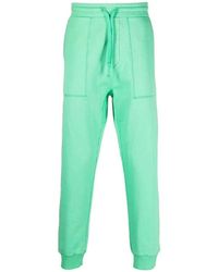 Nanushka - Pantaloni a vita alta verde menta con logo ricamato - Lyst