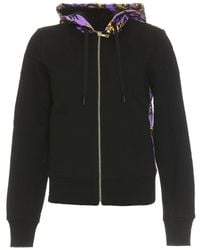 Versace - Felpa nera con cappuccio e stampa lilac logo brush couture - l - Lyst