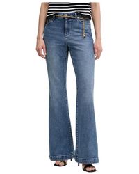Michael Kors - Stretch Cotton Belted Flared Jeans - Lyst