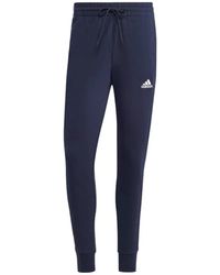 adidas - Pantaloni sportivi blu uomo con french terry e 3 strisce - Lyst
