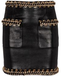 Balmain - Gonna corta in pelle di agnello con catene - Lyst