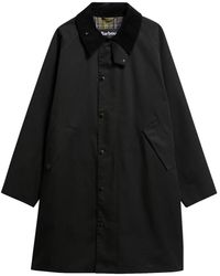 Barbour - Jassen ,Zwart ,Katoen Long Transport Showerproof Jacket - Lyst