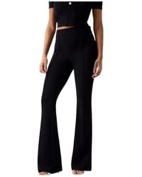 Guess - Broeken ,Zwart ,Polyester Nieuwe Flared Evelina Pantalon - Lyst