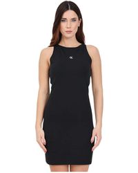 Calvin Klein - Vestido negro con estampado de logo y espalda nadadora - Lyst