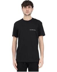 Calvin Klein - T-shirt e polo nere con logo bianco - Lyst