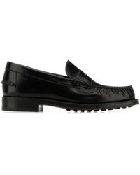 Tod's - Klassische schwarze lederslipper - Lyst