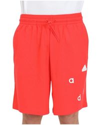 adidas - Performance shorts rossi con patch logo e lettering - Lyst
