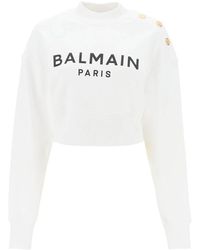 Balmain - Cropped sweatshirt mit logo-print und knöpfen - Lyst