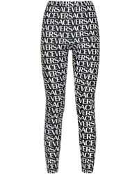 Versace - Geprinte Leggings Met Logo Overal - Lyst