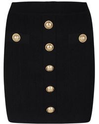 Balmain - Falda mini negra con botones tejida - Lyst