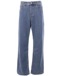 Valentino Garavani - Baggy-fit denim jeans mit leder-logo-patch - Lyst