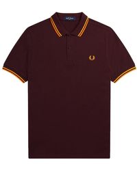 Fred Perry - Slim fit twin tipped polo in oxblood/electric yellow/gold f perry - Lyst
