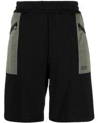 McQueen - Korte Broeken ,Zwart ,Katoen Twee-Tone Elastische Track Shorts - Lyst