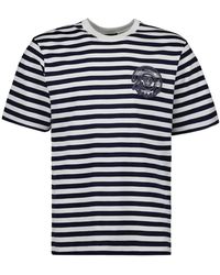 Versace - Gestreiftes t-shirt mit gesticktem logo - Lyst