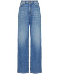 Valentino Garavani - Blaue jeans mit v gold detail - Lyst