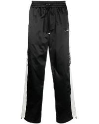 Amiri - Pantaloni da allenamento in cotone nero con bande laterali a contrasto - Lyst