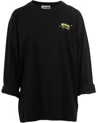 Moschino - Tops ,Zwart ,Lange Mouw Grafisch T-Shirt Zwart - Lyst