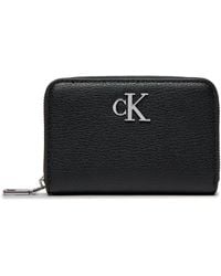 Calvin Klein - Mini portafoglio in ecopelle con logo metallico - Lyst