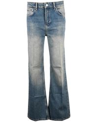 Moschino - Low Rise Bootcut Jeans - Lyst