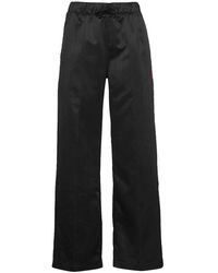 Pantalones de pernera ancha y palazzo Nike de mujer: hasta el 45 % de  descuento | Lyst