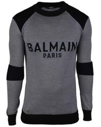 Balmain - Grauer wollpullover mit schwarzem logo - Lyst
