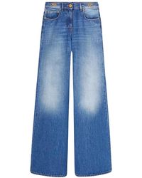 Versace - Flared denim jeans - Lyst