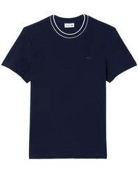 Lacoste - Tops ,Blauw ,Katoen Stretch Piqué T-Shirt Met Gestreepte Kraag - Lyst