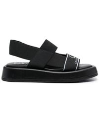 Casadei - Flat sandals - Lyst